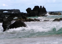 Lone_Fisherman_over_Ruff_Waters2C_Hawaii.jpg